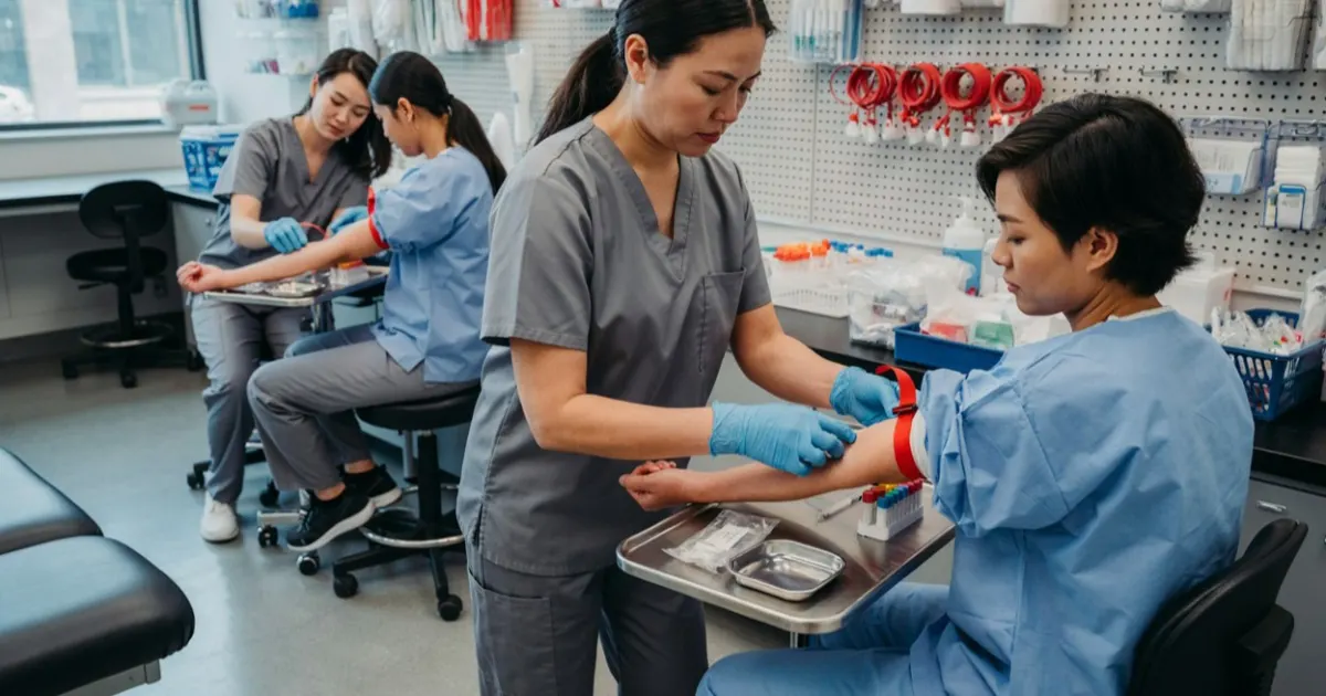 Students training in a phlebotomy program